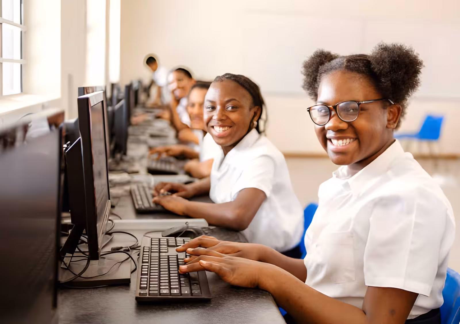 Students learning in a computer lab