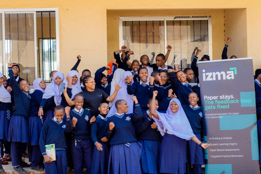 A group of students and Izma team members celebrating together